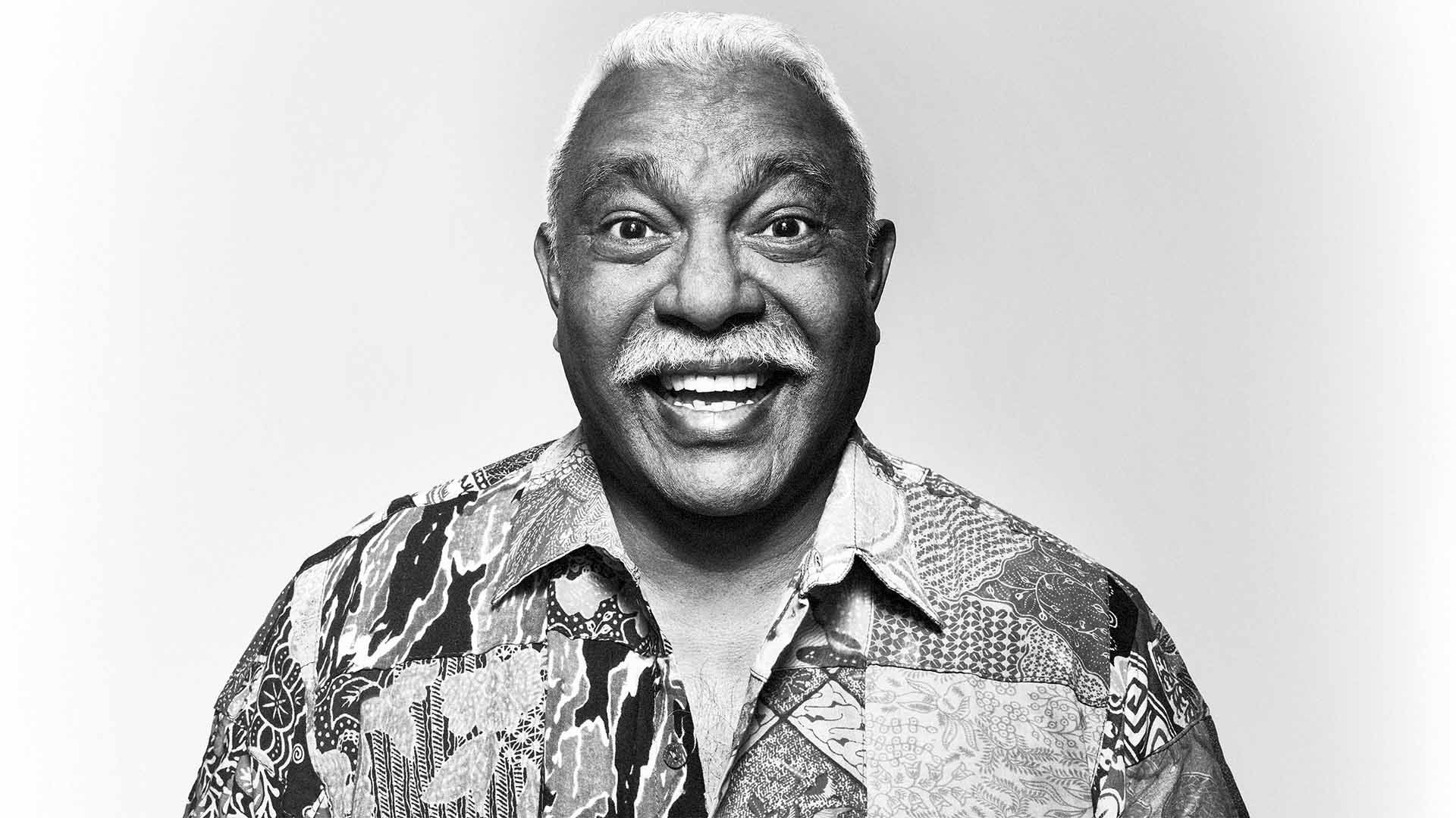 Smiling man looking to camera.