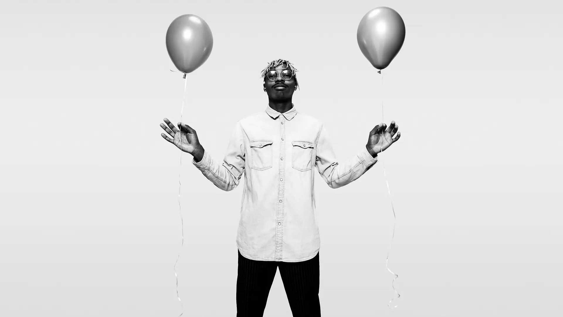 Man with two baloons