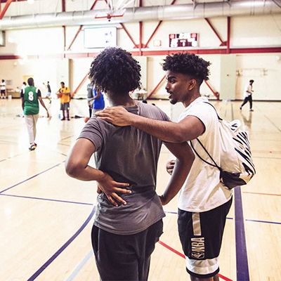 Photo of young men playing basketball.