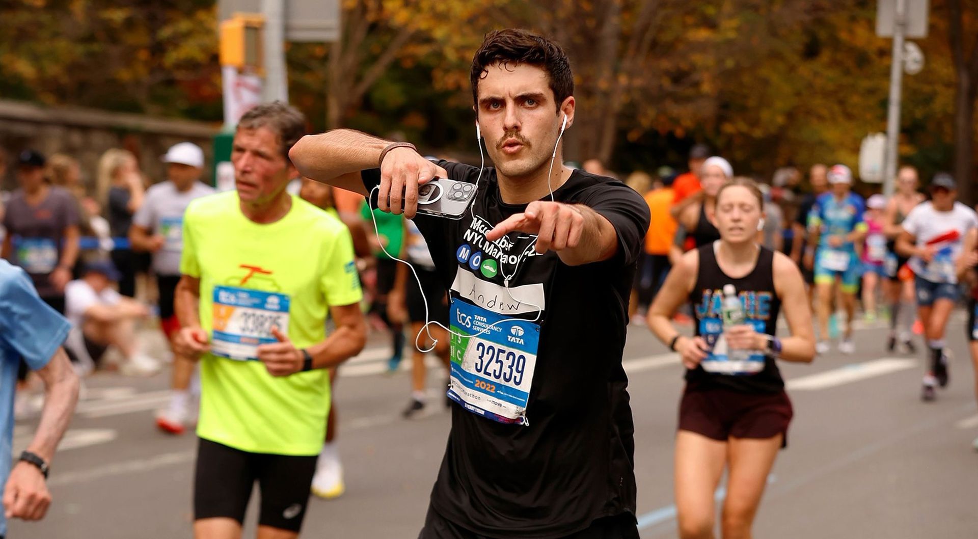 Frontal view of Movember supporter competing in TCS New York City Marathon.