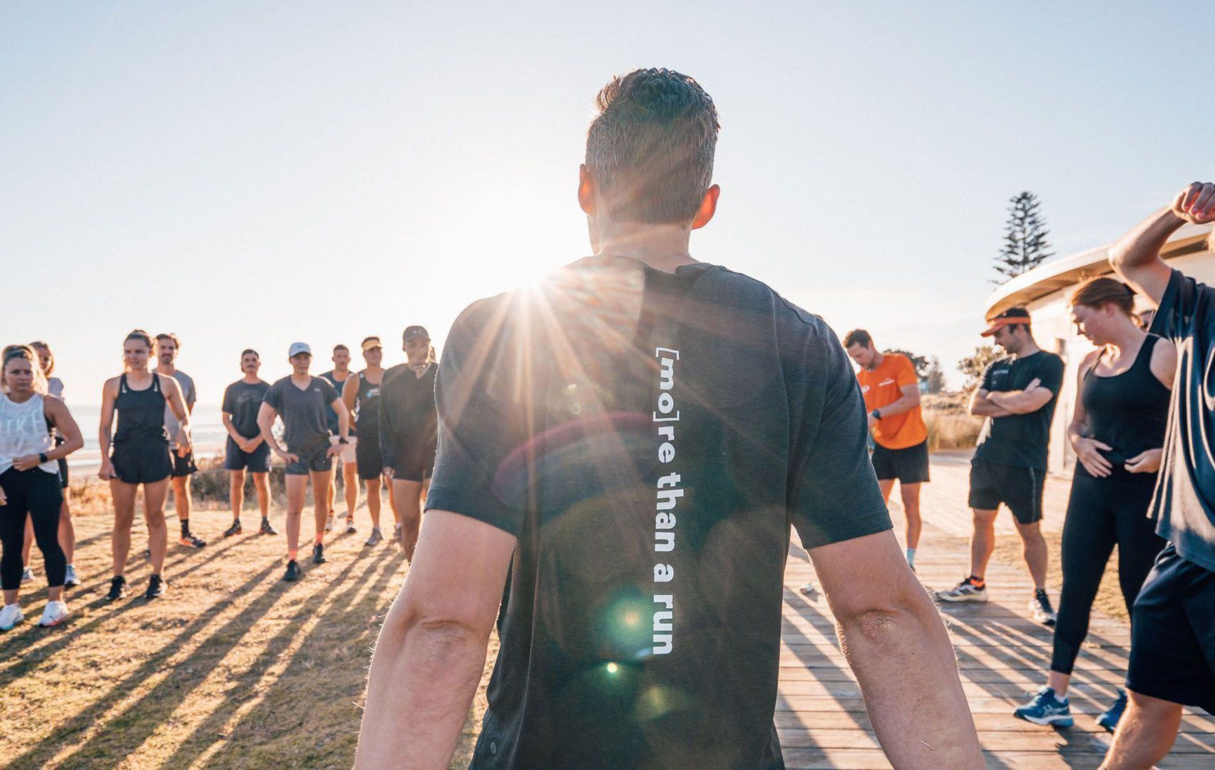 Photo of a [MO]re Than A Run race meeting showing assembled runners