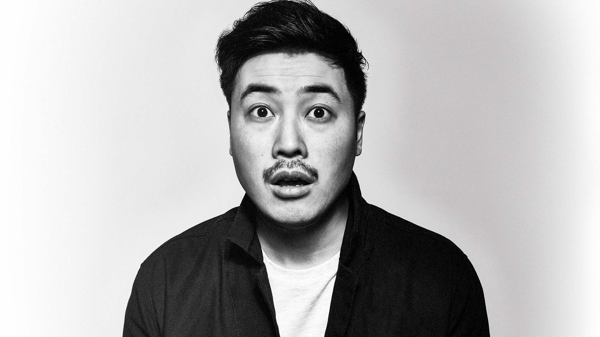 Smiling man looking to camera.