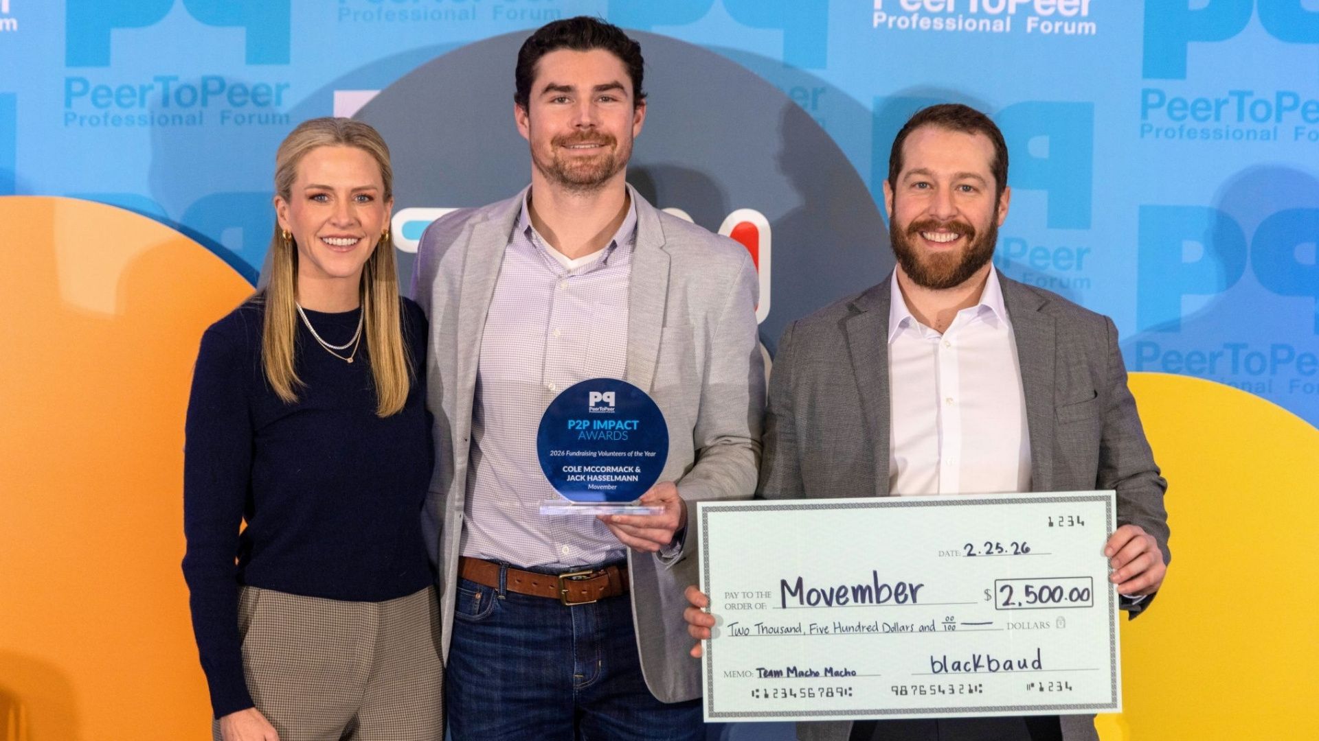 A group of Movember supporters pose with an award and donation check