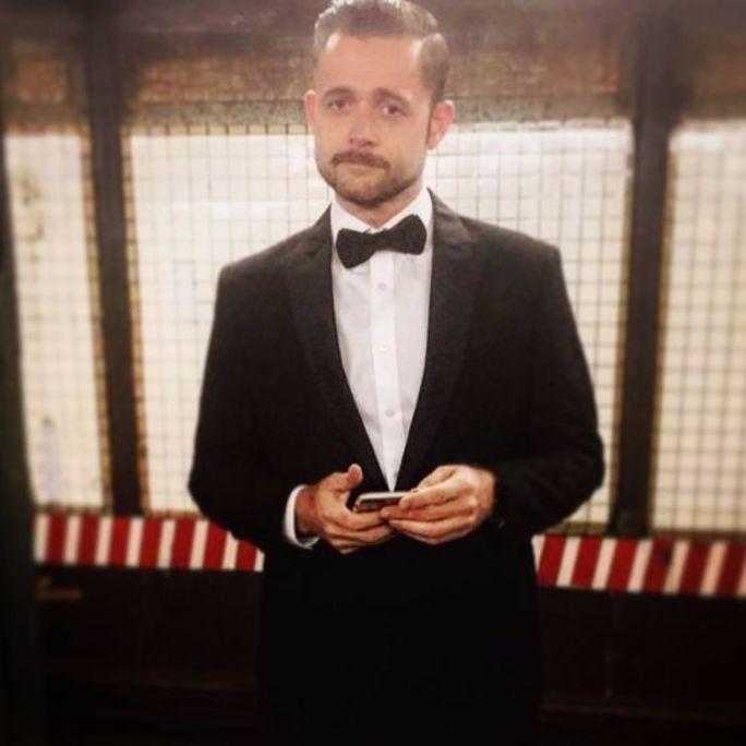 Photo of handsome young man, wearing a dashing tuxedo.