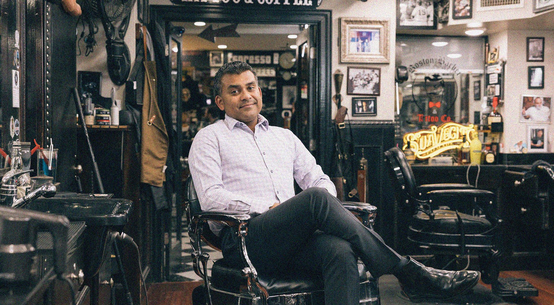 A man sitting in a barber chair 