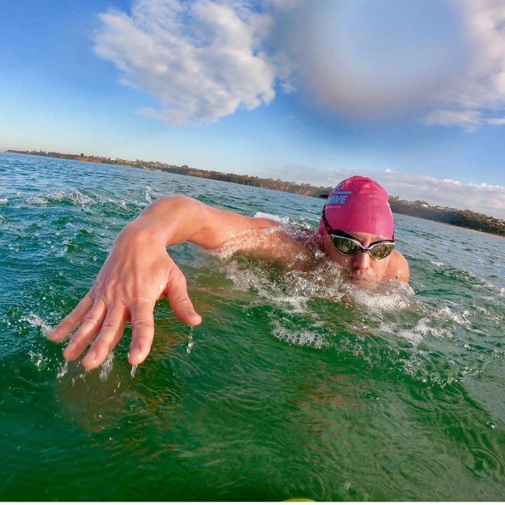 Mo Bro Luke Richards swimming near the beach.