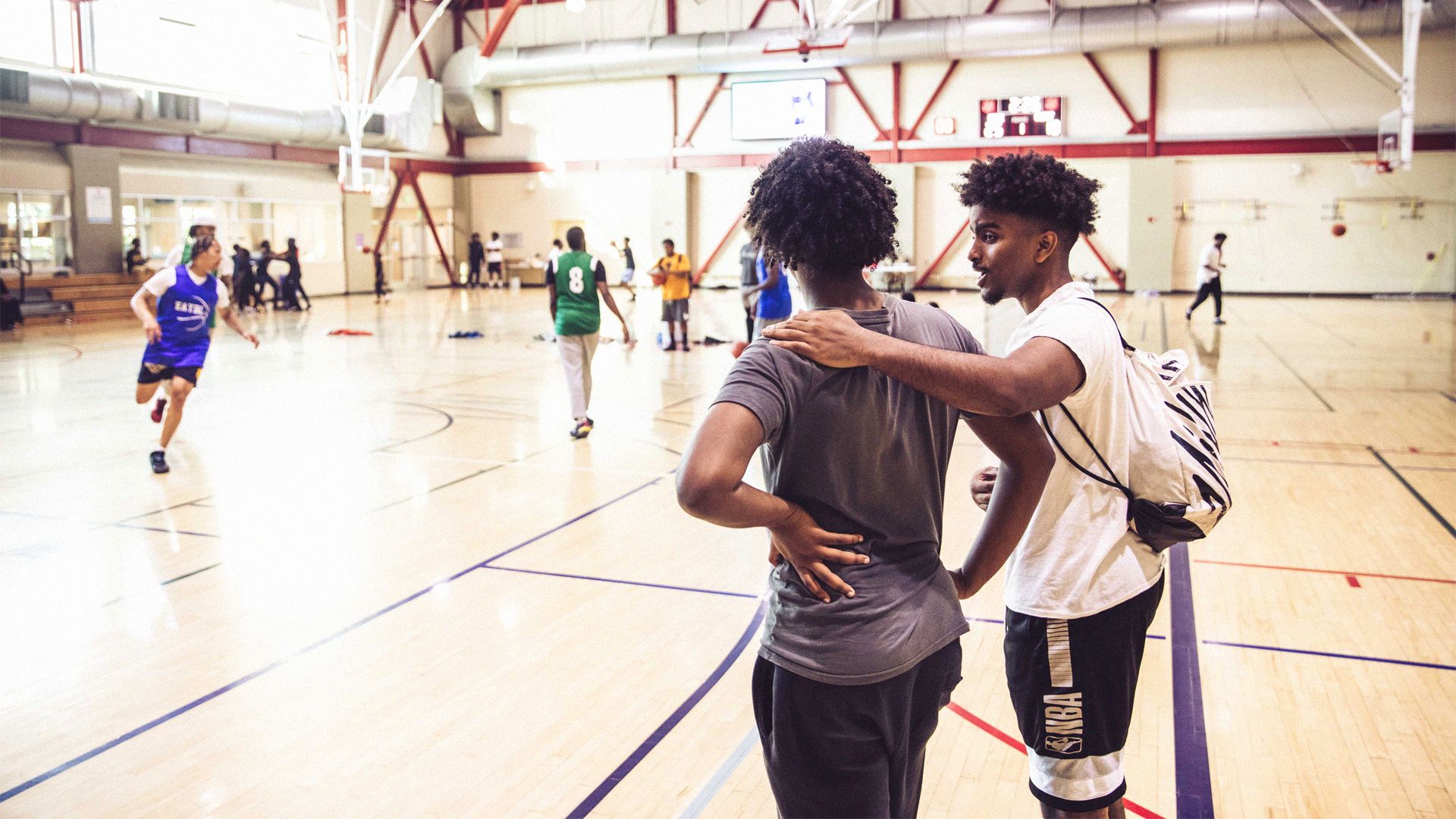 Two young men on a basketball court