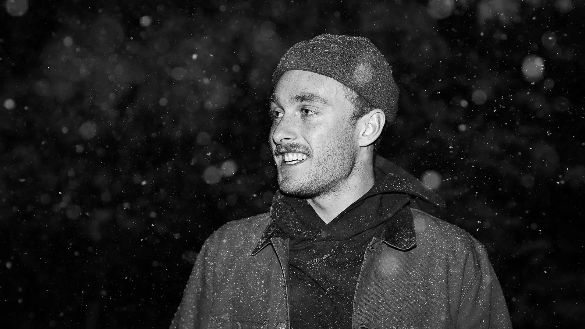 Man pondering impending family get-together during the holidays.