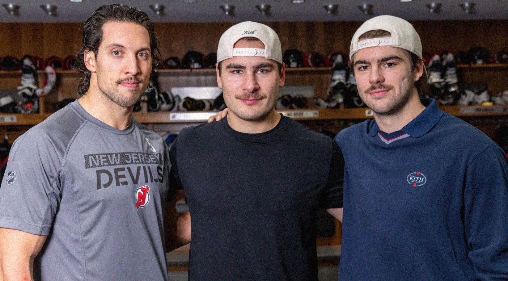 A photo of 3 New Jersey Devils hockey players: Left: Brenden Dillon Middle: Timo Meier Right: Nico Hischier (team captain and Movember captain)