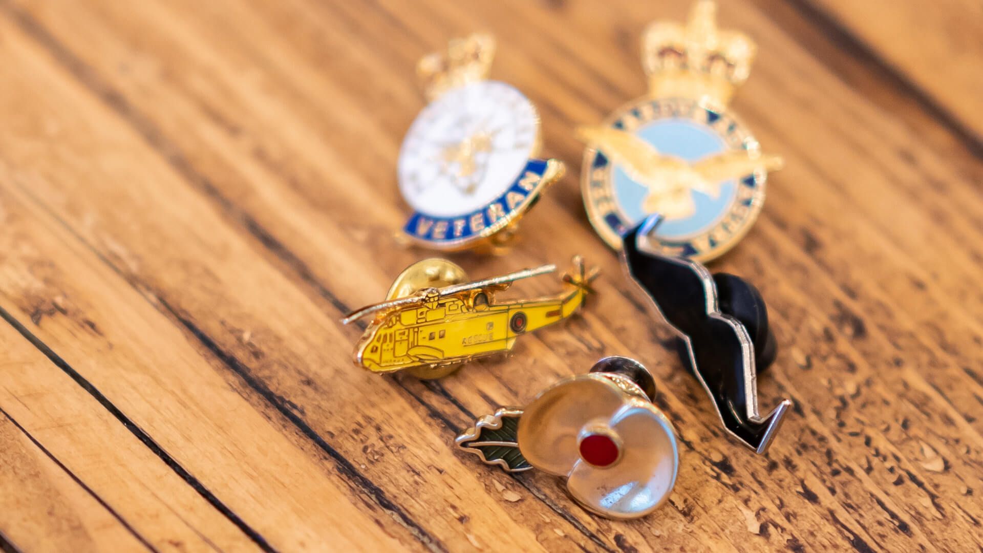 A collection of pin badges